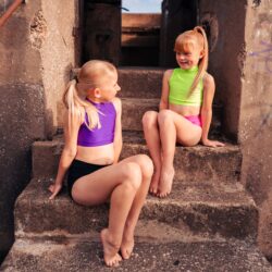 two dancers sitting on steps
