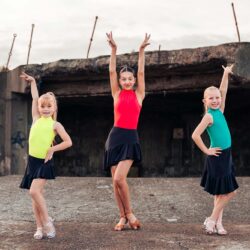 three dancers in skirts and leotards